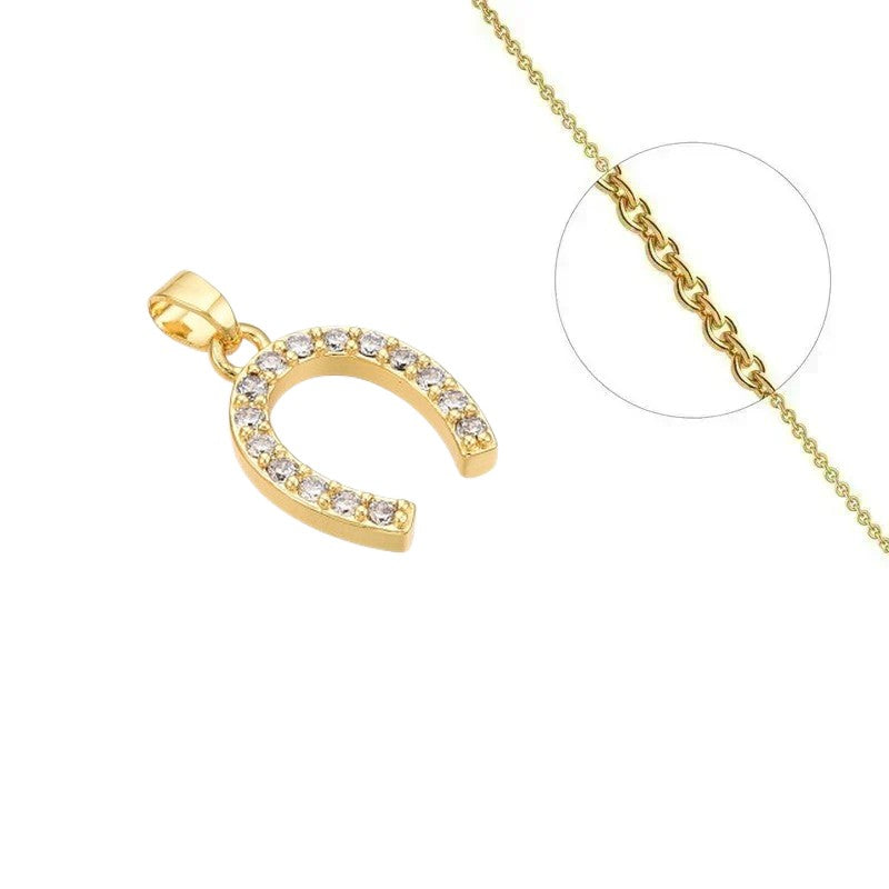 Collier doré chaîne et pendentif fer à cheval orné de zirconiums sertis