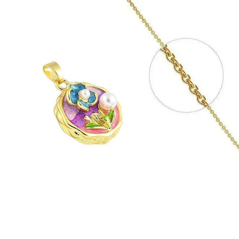 Collier doré chaîne et pendentif floral émail zirconiums sertis