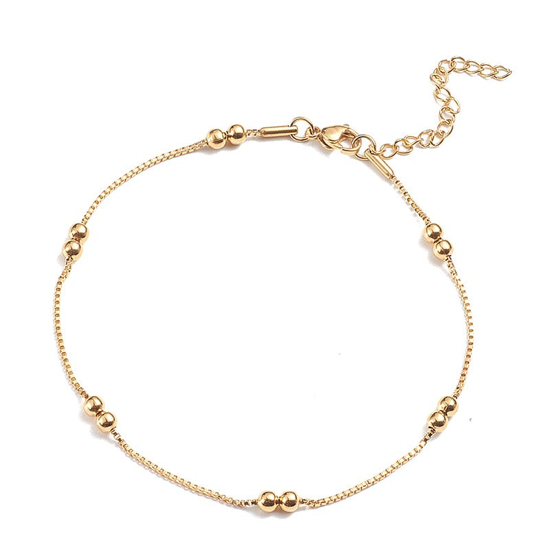 Chaîne de cheville acier inoxydable doré avec perles rondes