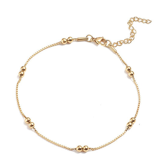Chaîne de cheville acier inoxydable doré avec perles rondes