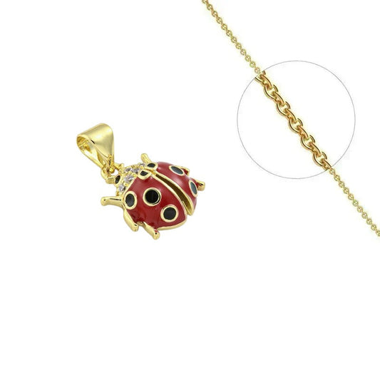 Collier doré chaîne et pendentif coccinelle rouge à points noirs orné de zirconiums sertis